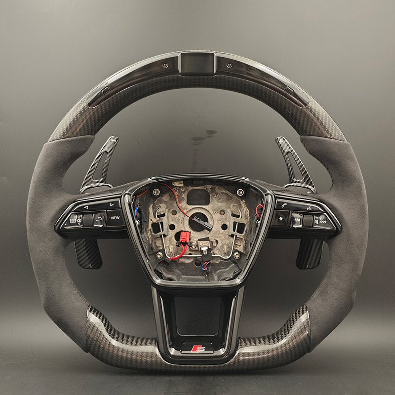 Carbon-pattern steering wheel for the Audi A4 and A5 with grey suede grips, an LED top display and paddles